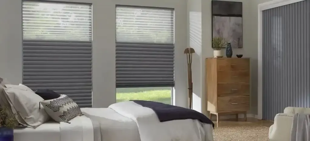 Bedroom with a bed and tri-shade window coverings