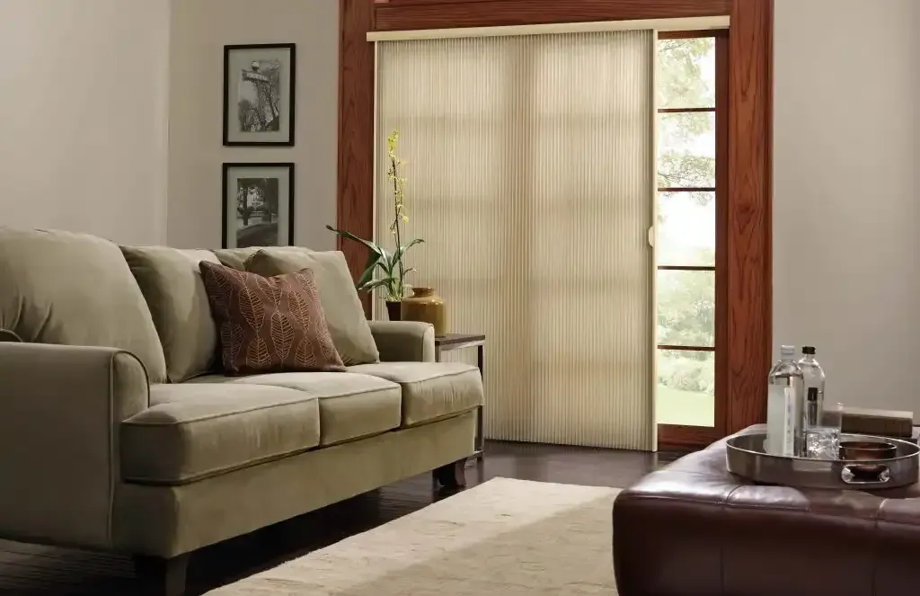 Living room with a beige couch and window shades